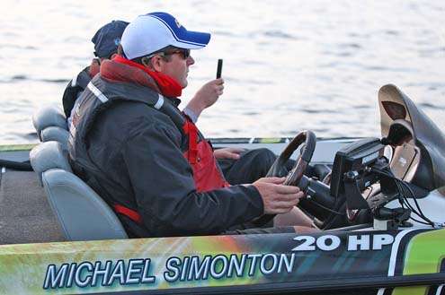 <p>
	Michael Simonton, another 2012 Elite Series rookie this season, goes through check out, while his Marshal records the process on his smart phone.</p>
