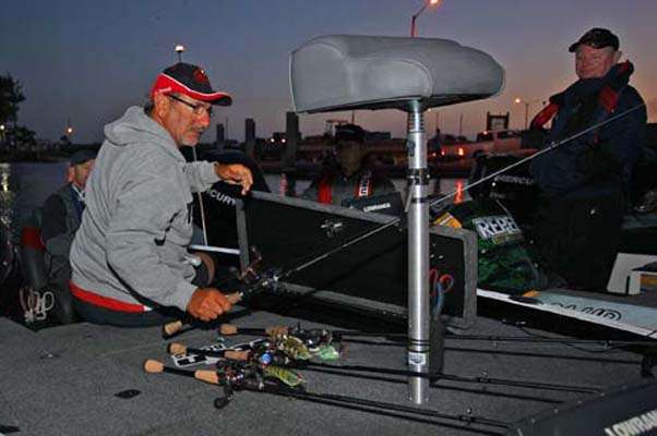 <p>
	Paul Elias gets his rods ready for the day.</p>

