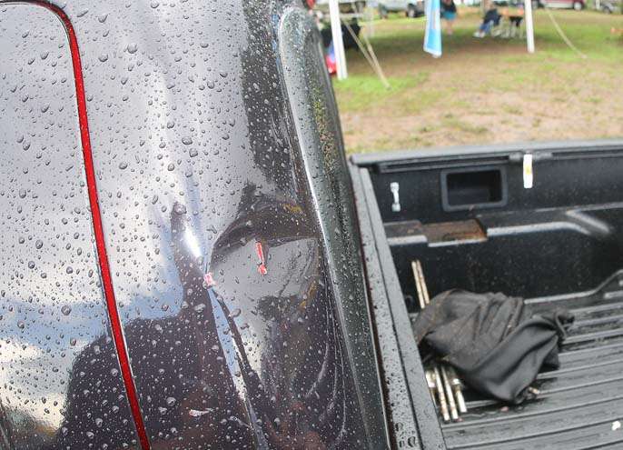 <p>
	A dent is evident on the back of a Toyota truck on display at the weigh-in area. The dent was formed by a flying table during the height of the storm.</p>
