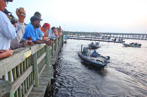 <p>
	Fans line a dock near the take-off area rooting for their favorite anglers as they pass through boat check.</p>
