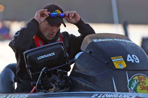<p>
Evers adjusts his glasses before taking off for Day Two of competition.</p>
