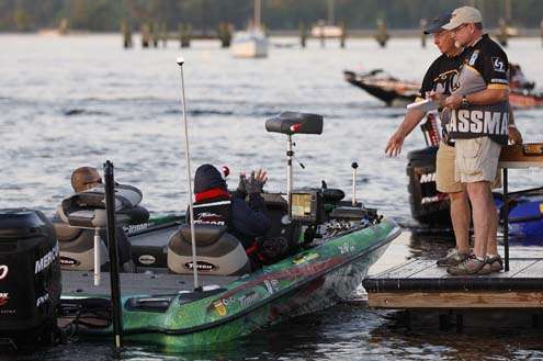 <p>
	 </p>
<p>
	Shaw Grigsby reaches to catch his timing tag at the check-out dock.</p>
