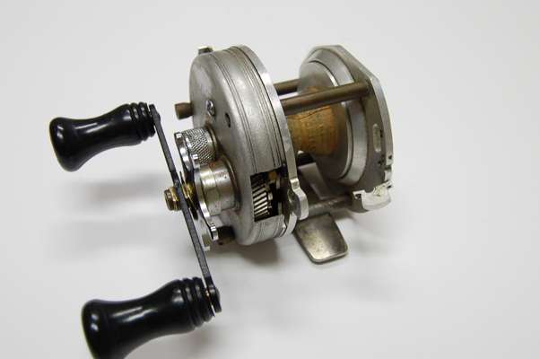 <p>
	A picture is worth a thousand words. Lew Childre greatly modified a round baitcast reel of the time as a way to explain some of the new design differences he desired in his new Speed Spool. The crude prototype clearly shows the no-knob palming plate, the modified spool and various other tweaks he was pursuing. It is the prototype that Childre presented to Shimano to follow for building the first Speed Spool. The Speed Spool was introduced into the market in 1973, just a couple of years after Lewâs Speed Stick rods brought their own level of innovation to sport fishing.</p>
