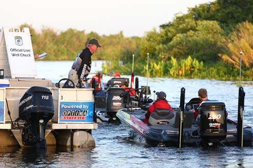 <p>
	Brandon Card passes the check-out boat Friday.</p>
