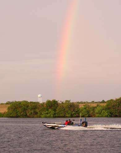 <p>
	A rainbow is evident as Chris Lane takes off for the final day.</p>
