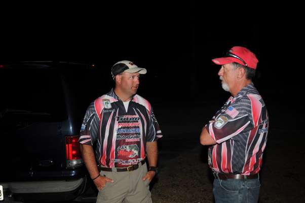 <p>
	Georgia co-anglers Brian Elder (left) and Roger Morrow wait for their rides to the ramp. </p>
