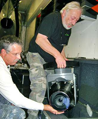 <p>
	Barth and Cassidy prepare their gyro-stabilized camera, which costs as much as the helicopter.</p>
