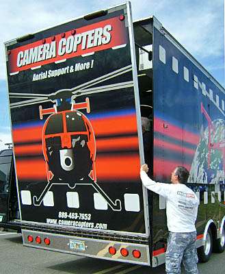 <p>
	Cassidy begins the process of getting the copter out of the trailer.</p>
