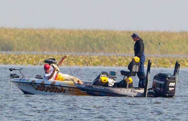 <p>
	Dave Smith cradles a nice keeper and brings it safely into the boat.</p>
