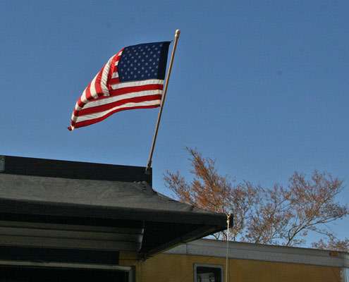 <p>
	The American flag blows in the strong spring wind just prior to the Day One weigh-in.</p>
