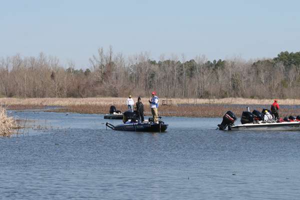 <p>
	Todd Faircloth fishes within a boat's length of a group of spectators that are focused on Edwin Evers nearby.</p>
