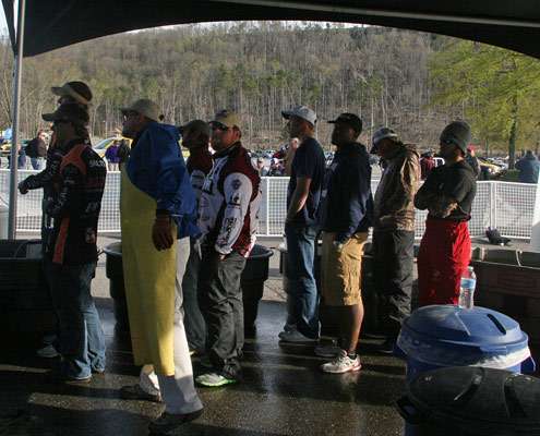 <p>
	The final group of anglers prepare to weigh their fish.</p>
