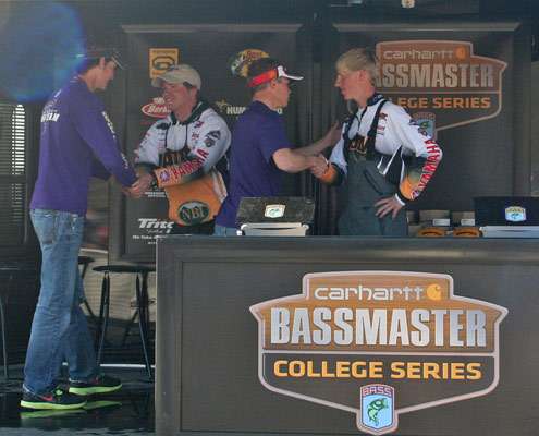 <p>
	Ross and Swims congratulate Strock and Darnell after the Bethel anglers claimed the first place prize.</p>
