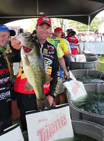 <p>
	Kevin VanDam shows off one of the fish that put him back in the game today.</p>

