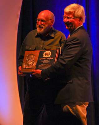 <p>
	Precht and Crawford pose with the Hall of Fame plaque. </p>
