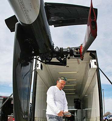 <p>
	Barth rides the trailer door back up to access the tail and add things like fins.</p>
