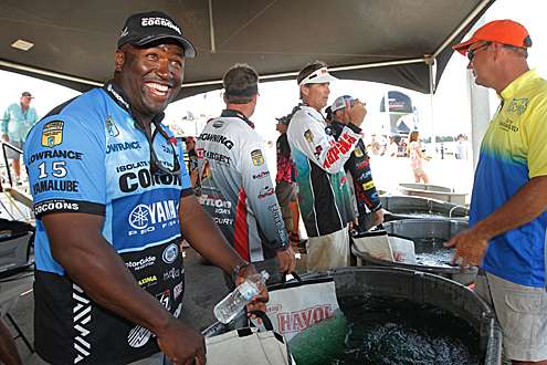 <p>
	Ish Monroe jokes with other anglers as he prepares to weigh in Friday.</p>
