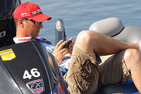 <p>
	Faircloth kicks back with his phone after a long day of fishing.</p>
