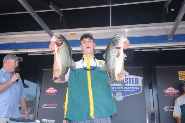 <p>South Africaâs Willem Lubbinge holds up a couple of his big bass from his winning 19-4 limit. </p>

