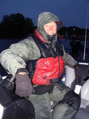 <p>
	Somewhere under that rain gear is legendary bass pro Tommy Martin. Friday was rainy and cold. When the front pushed through, bright sunshine and a high barometer killed Martinâs hot jig bite.</p>
