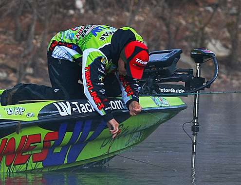 <p>
	Chapman works on removing some line from his trolling motor.</p>

