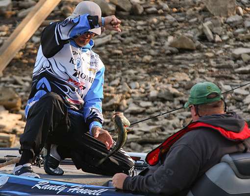 <p>
	Howell fights to secure the bass, while his Day One Marshal watches the action. </p>
