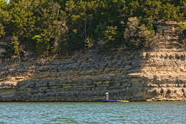 <p>
	Steve Kennedy fishes one of the many bluff walls on Bull Shoals. </p>
