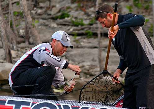 <p>
	Winans lands his first fish of the day. </p>
