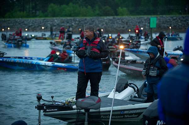 <p>
	Anglers anxiously wait for the sun to rise and rain to stop.</p>
