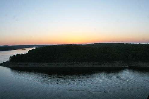 <p>
	The sun rises over the hills containing Bull Shoals Lake, as shot from the CameraCopters chopper.</p>
