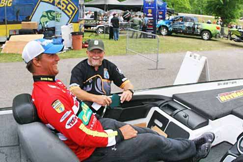 <p>
	Keith Poche shares a laugh with Senior Tournament Manager Chuck Harbin as  he goes through the weigh-in line.</p>
