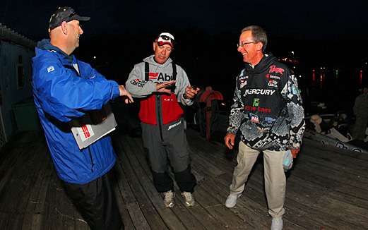 <p>
	B.A.S.S. emcee Dave Mercer and Charlie Hartley get a kick out of a Scott Rook story before launch on Day Two of the TroKar Quest on Arkansas' Bull Shoals Lake.</p>
