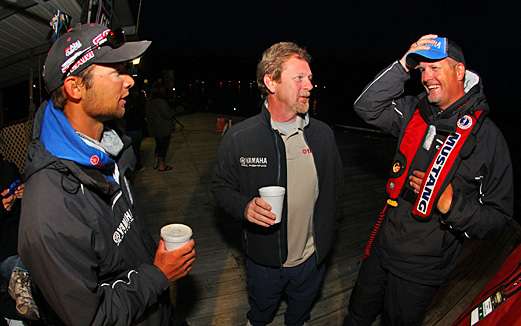 <p>
	Day One leader Brandon Palaniuk, Yamaha's Dave Ittner, and Scott Ashmore converse before Day Two at the TroKar Quest on Bull Shoals Lake.</p>
