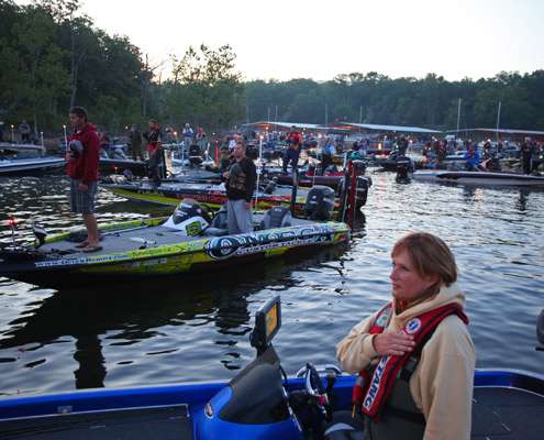 <p>
	Anglers stand and remove their hats for the playing of the national anthem Thursday morning.</p>
