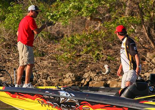<p>
	Gene Eisenmann swings a keeper aboard while his co-angler, Rick Emmitt checks out the action. </p>
