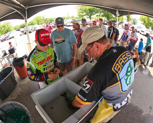 Brent Chapman has his fish bumped behind the weigh-in stage.
