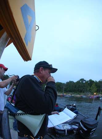 <p>
	Tournament director Chris Bowes gets the boats in order as they idle by the dock.</p>
