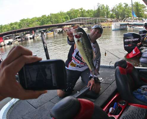 Winans holds up his biggest largemouth for a BASSCam video.
