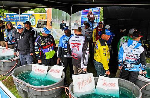 <p>
	 </p>
<p>
	Anglers wait in line at the tanks to weigh fish on Day Two.</p>
