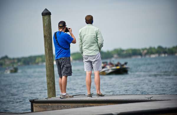 <p>
	Some B.A.S.S. fans take some photos as the anglers make their way back to the boat dock. </p>
