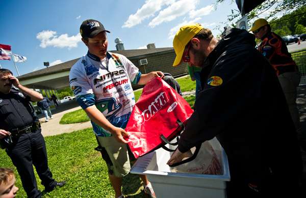 <p>
	Joey Nania gets ready to weigh his fish. </p>

