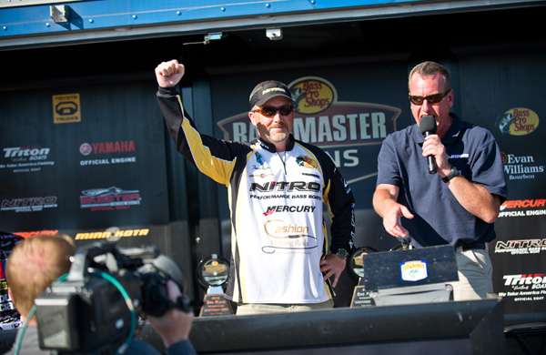 <p>
	Tracy Adams celebrates when he realizes he's won the pro division of the Bass Pro Shops Bassmaster Southern Open #2.</p>
