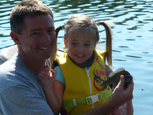 <p>
	Brystal, 2, fishes with her godfather on High Rock Lake in North Carolina.</p>

