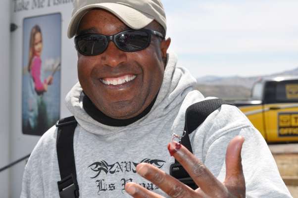 <p>
	Ron Welch of California manages a smile, even with a treble hook embedded in his cuticle.</p>
