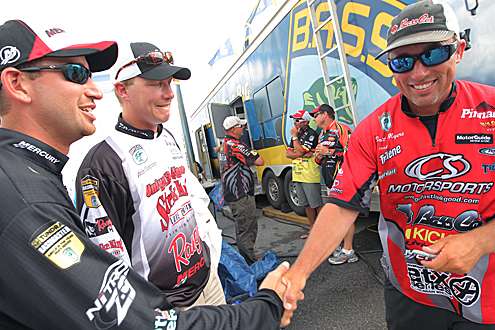 <p>
	Leader Britt Myers is congratulated by other top 12 anglers.</p>
