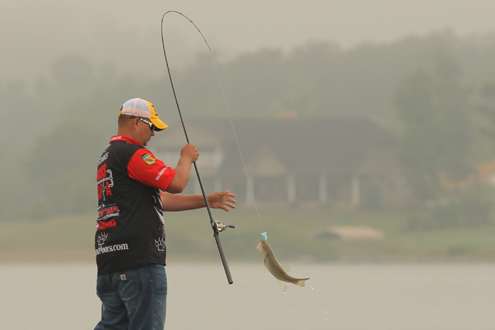 <p>
	Jeremy Starks reels in a good-size fish.</p>
