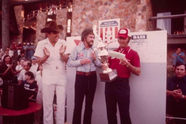 <p>
	Tommy Martin, who qualified for the 1974 Classic on Wheeler Lake, Ala., receives the check for his Classic championship.</p>
