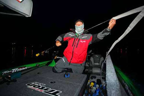 <p>
	Shaw Grigsby removes a rod wrap in preparation for Day One.</p>
