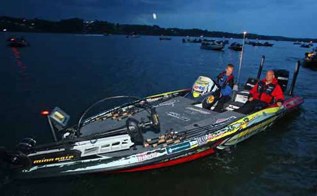 <p>
	Brandon Card, currently tied for 12th with 16-1, motors by the dock.</p>
