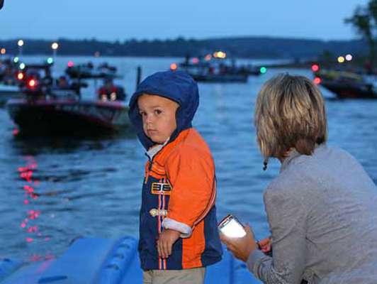 <p>
	T.J. Murray, son of John Murray, looks for his dadâs boat at the Day Two launch.</p>
